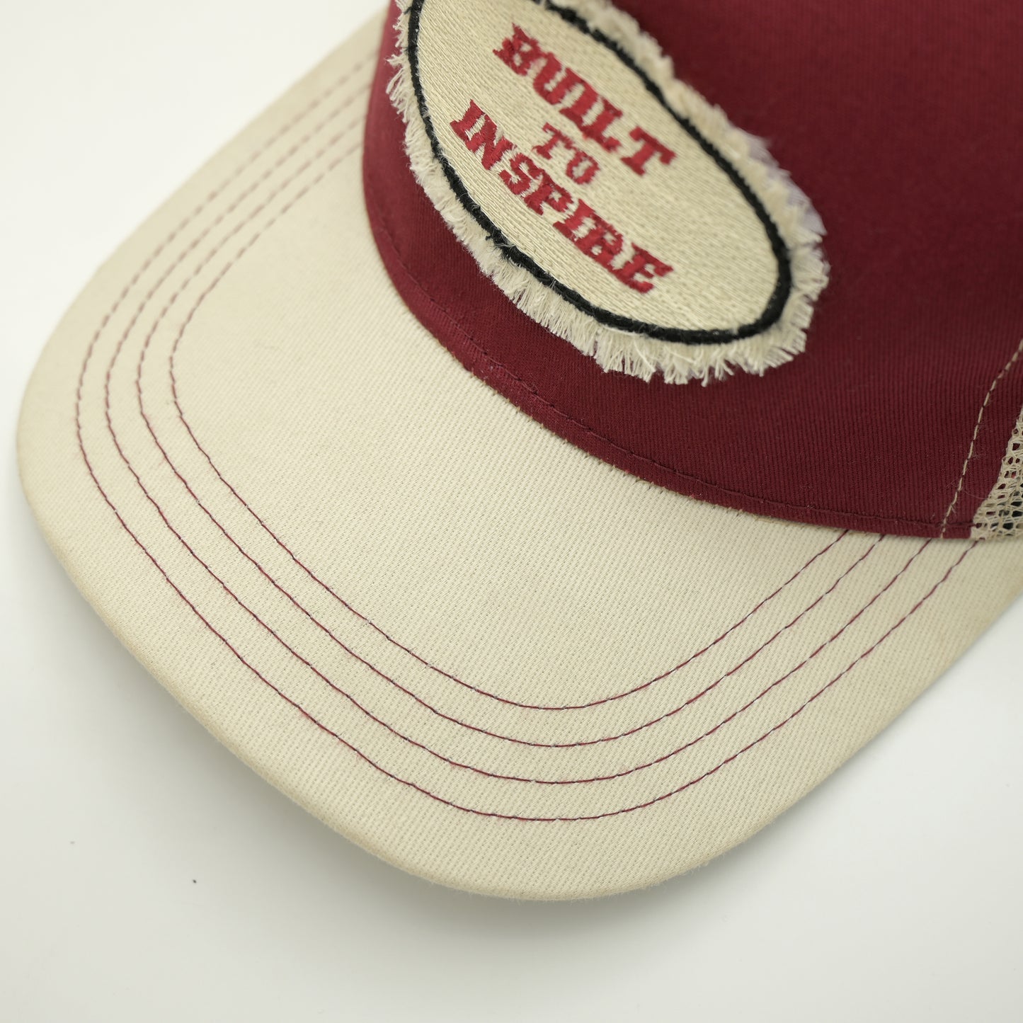 Distressed build to inspire trucker cap